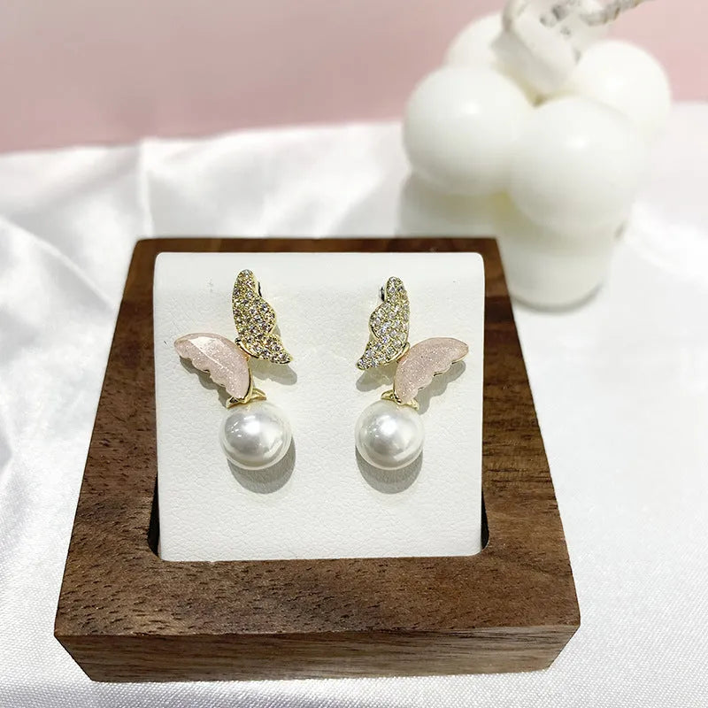 Pearl Zircon Bow Temperament Light Luxury Niche Earrings in pink colour, dangle style