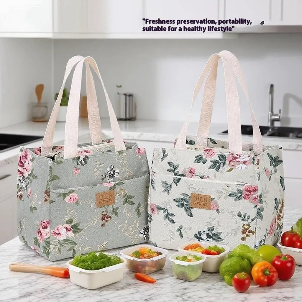Women's printed canvas bag with aluminium frame showing floral pattern design and horizontal square shape