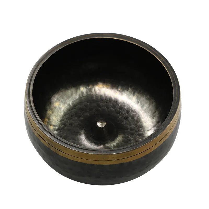 Black and gold copper sound bowl with Buddha design on thin pad, 12.5cm calibre