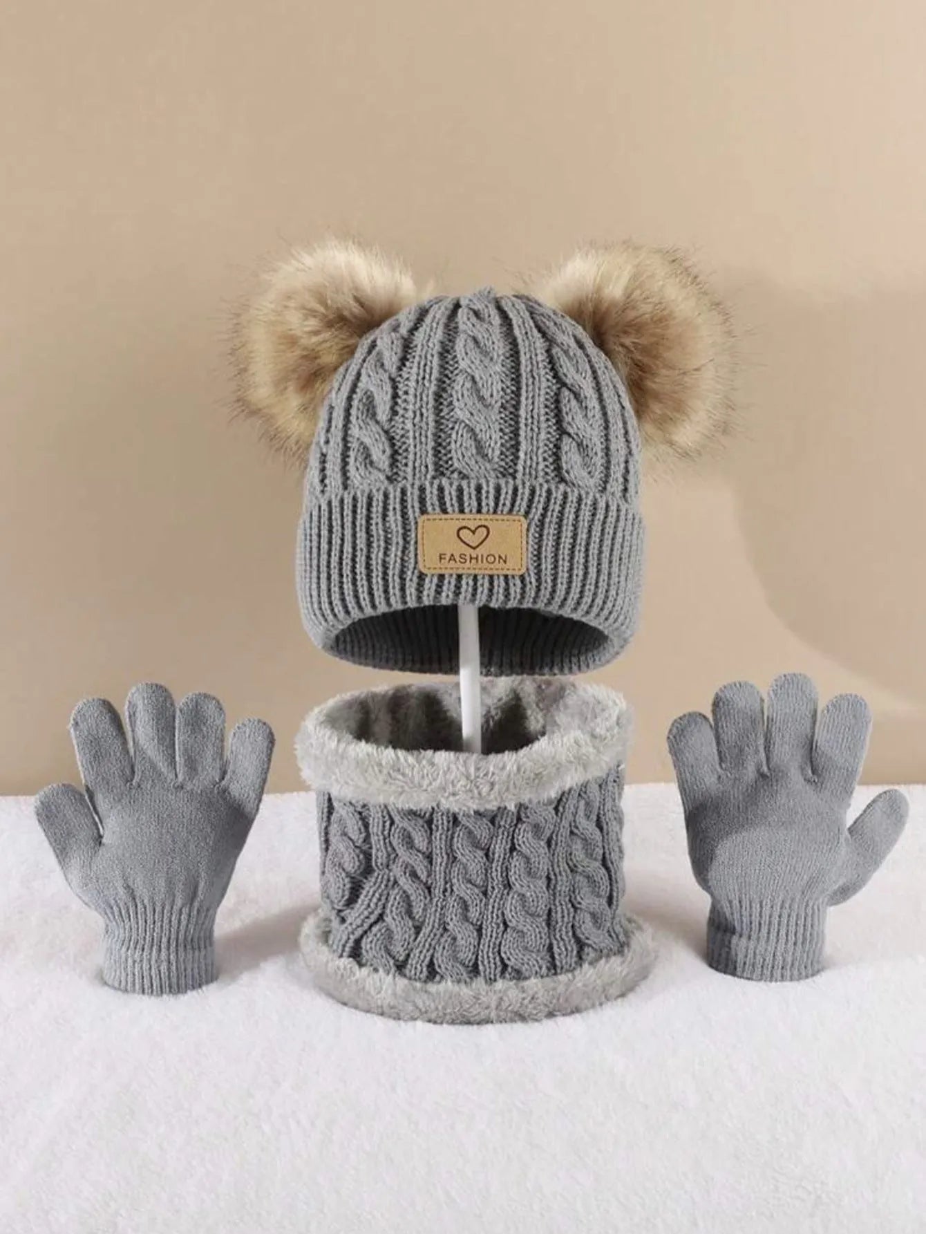 Children's three-piece acrylic knit winter set with dome crown hat and matching scarf and gloves in pink