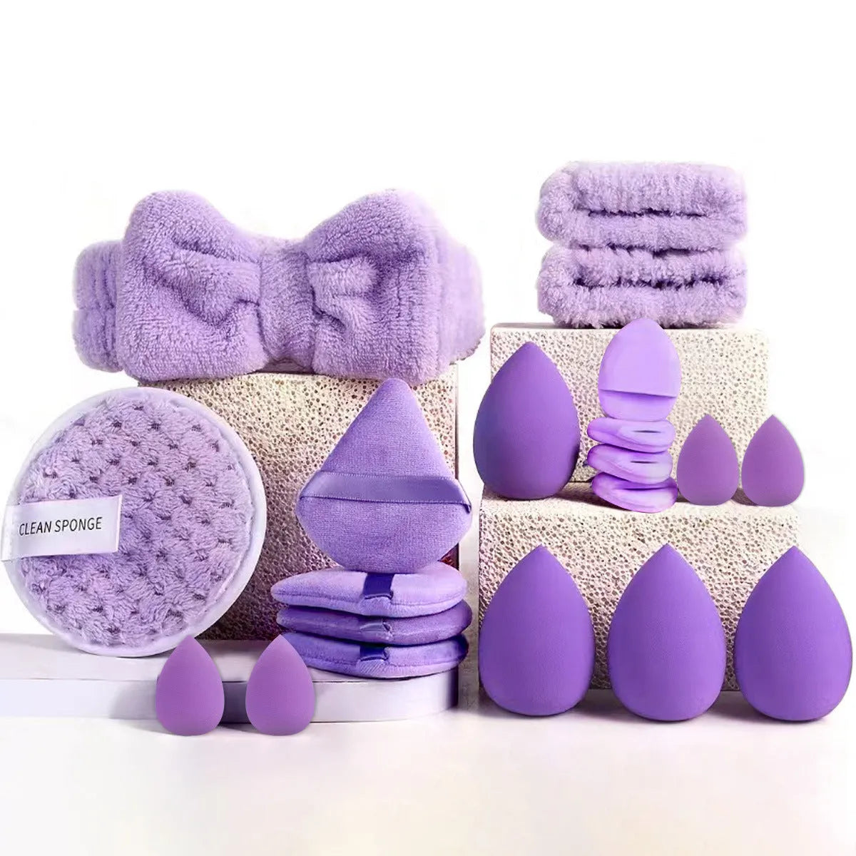 Hydrophilic non-latex beauty tools set with brushes in brown, pink, and purple colours for face washing and makeup