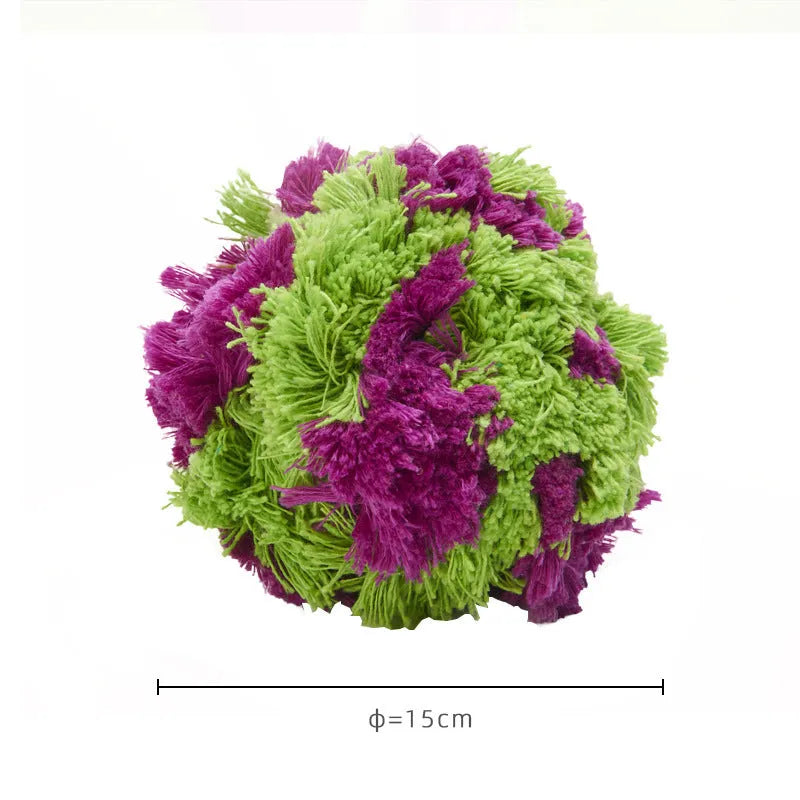 Purple plush dog seaweed ball toy with knotted design for chewing and fetch games