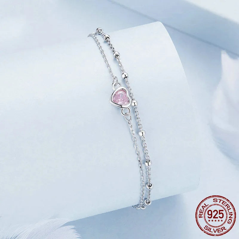 Sweet girlish style 925 sterling silver bracelet with a small heart-shaped pendant on an adjustable chain.