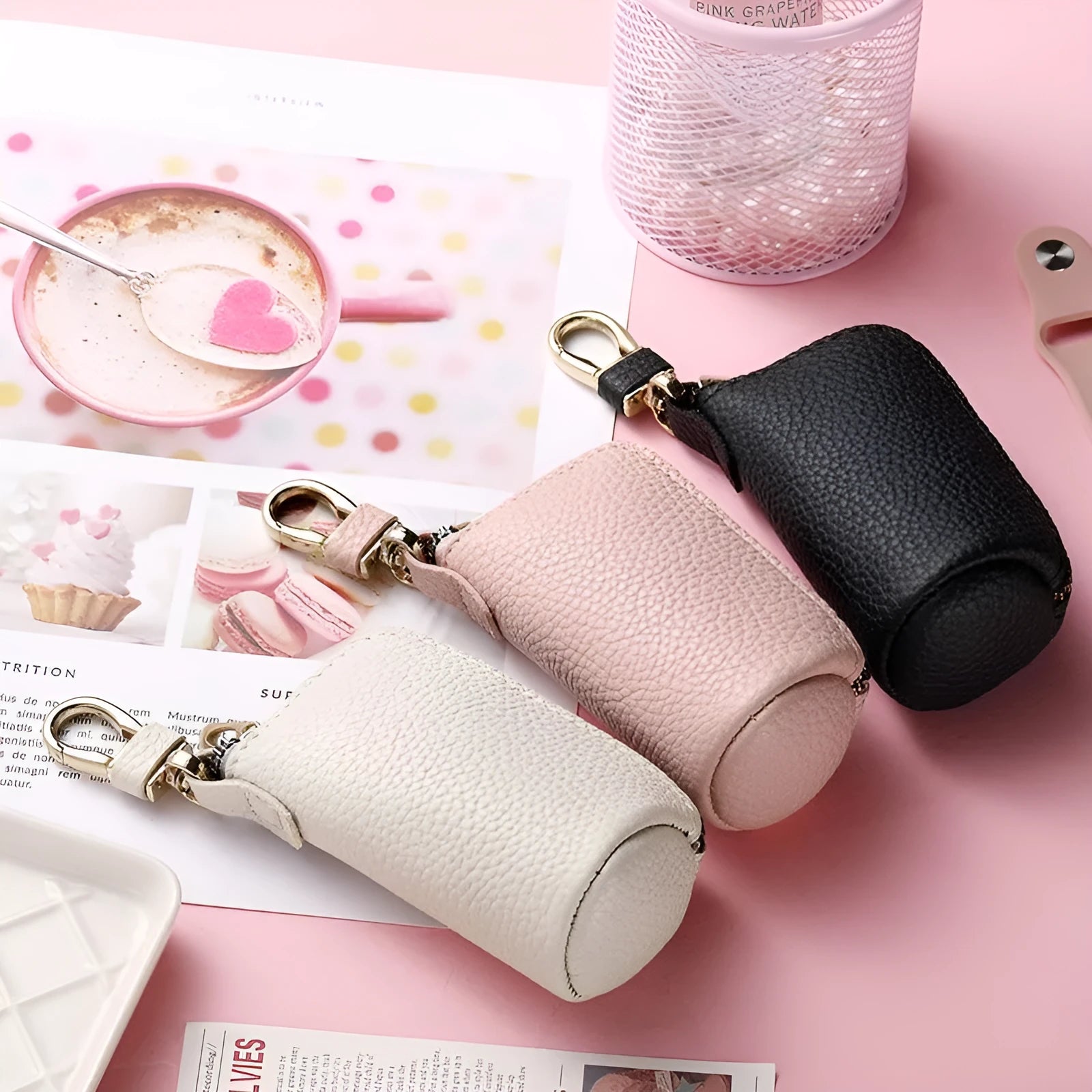 Men's fashion simple black PU leather zippered key ring case on a grey background.