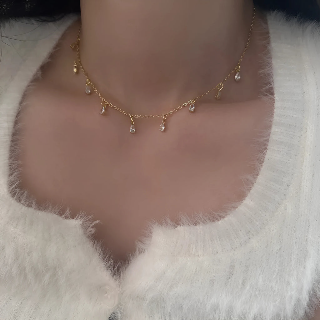 Zircon necklace, earrings, and anklet set with geometric meteor shower design on a regular chain.