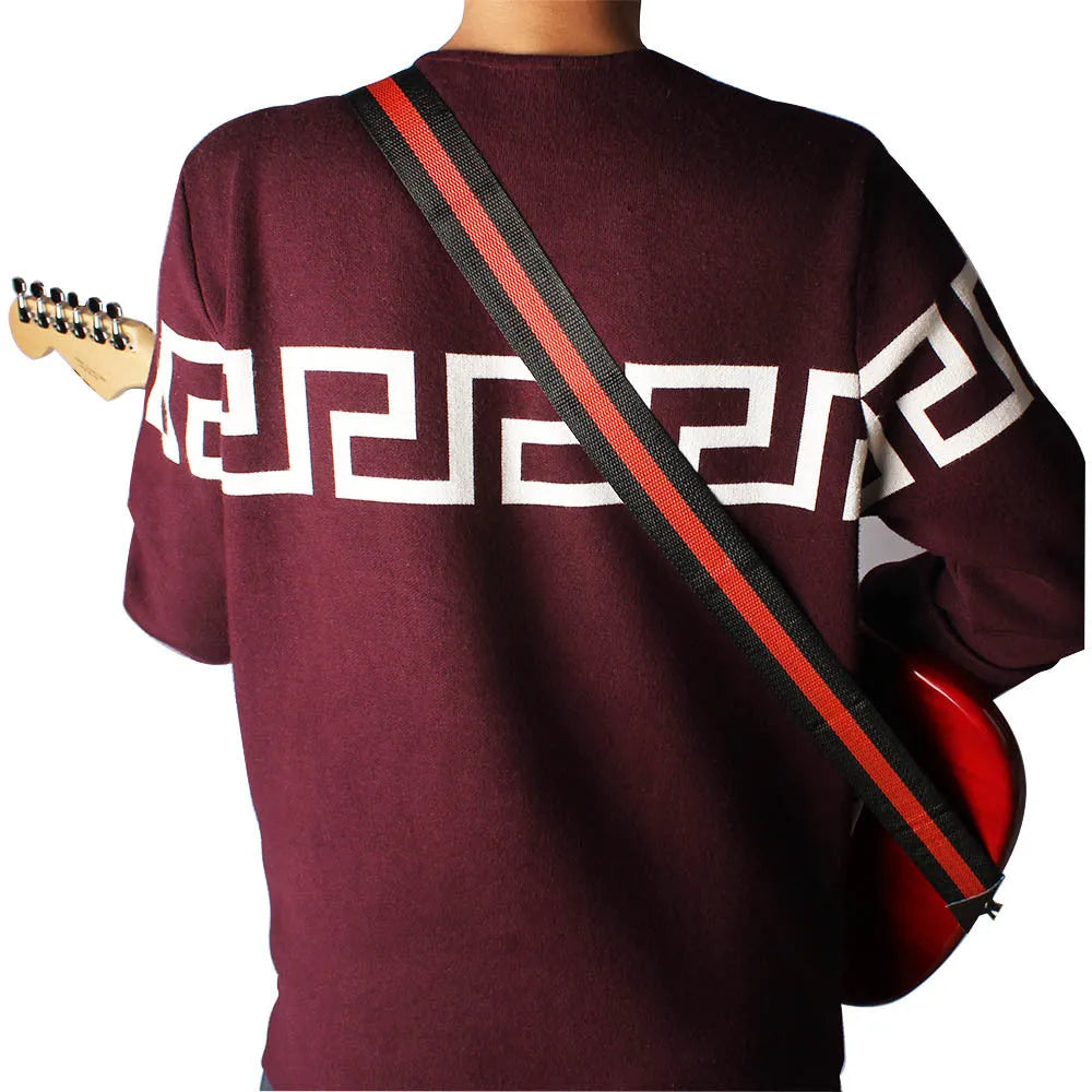 Folk stripe patterned woven instrument strap for electric guitar, bass, or ukulele.