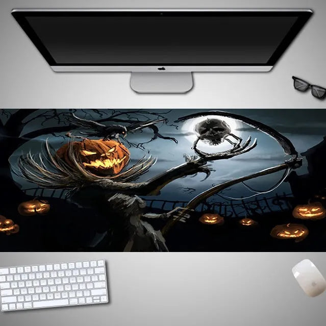 Oversized Halloween graphic cloth mouse pad on a desk, showing non-slip rubber base.