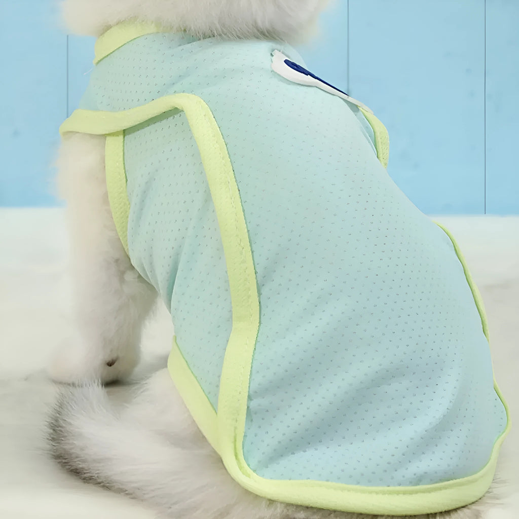 Grass green polyester cat vest for summer wear in size medium on grey background