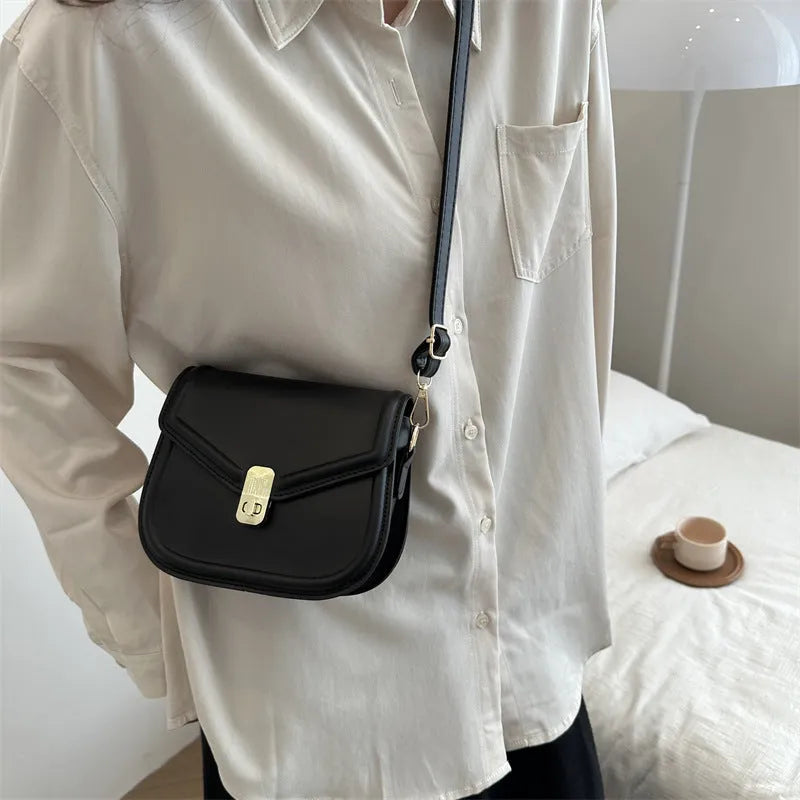 Soft PU leather clamshell messenger bag in horizontal square design shown in available colours.