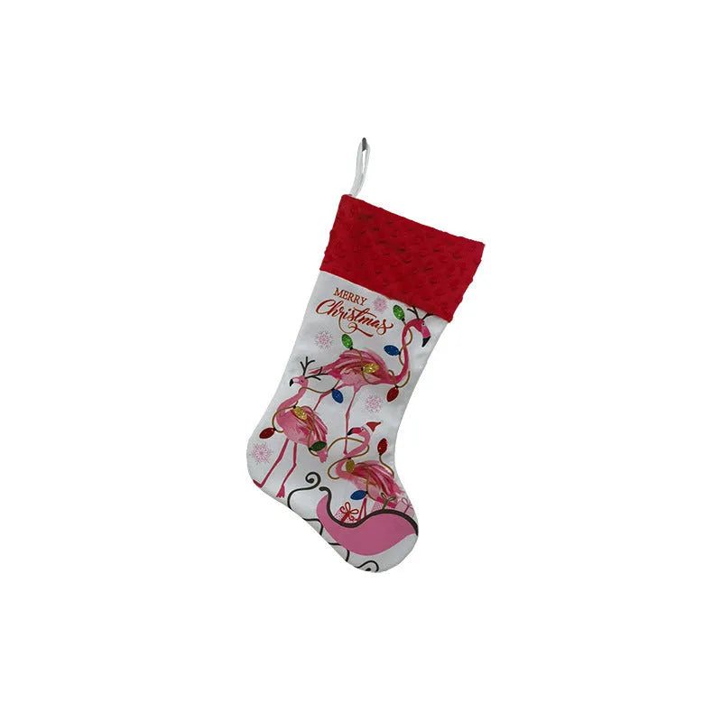 Red cloth flamingo Christmas stocking decoration with white trim, shown hanging.