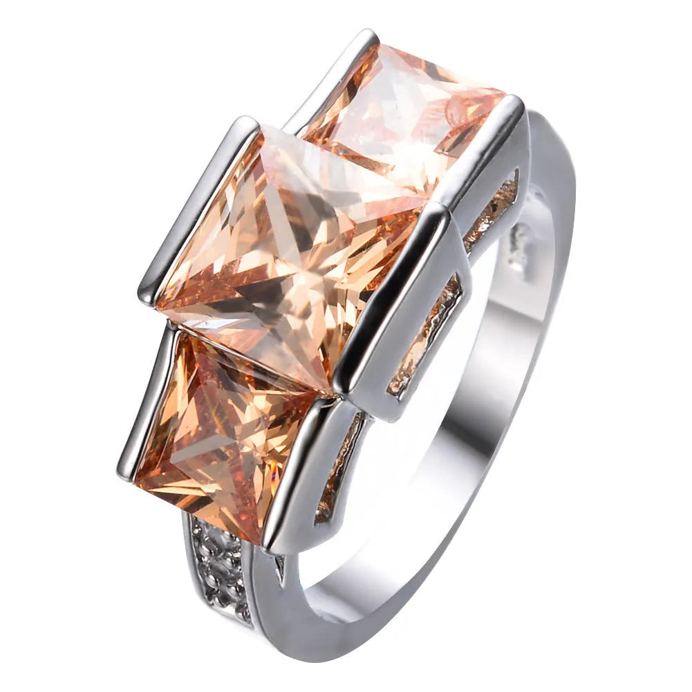 Geometric copper women's ring in champagne colour on a size no.8 finger, showing metal band and electroplated finish.