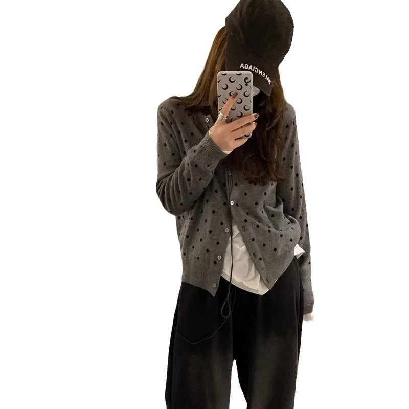 Women's gray dot pattern knitted cardigan with long sleeves and crocheted flower details