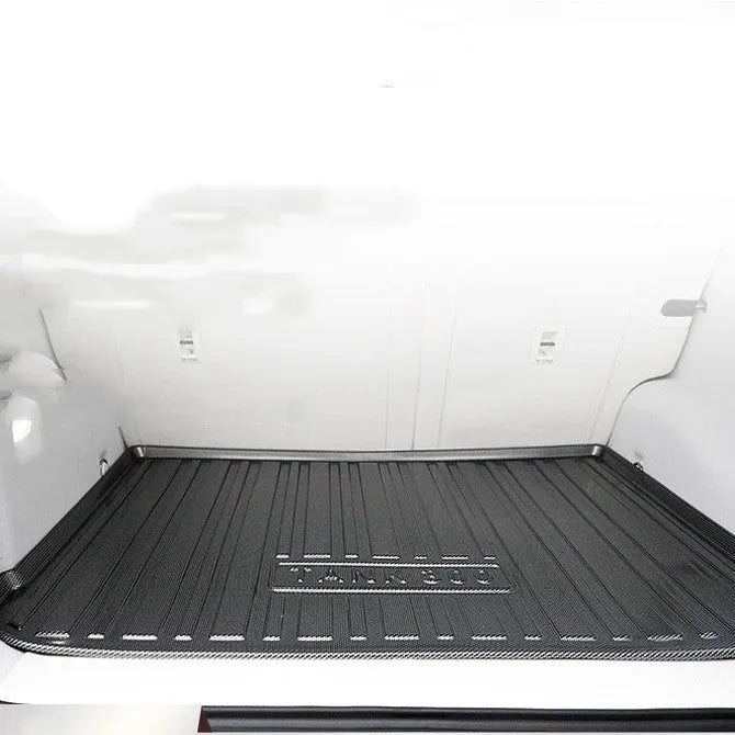 Black carbon fibre pattern TPE trunk liner pad for car boot floor protection.