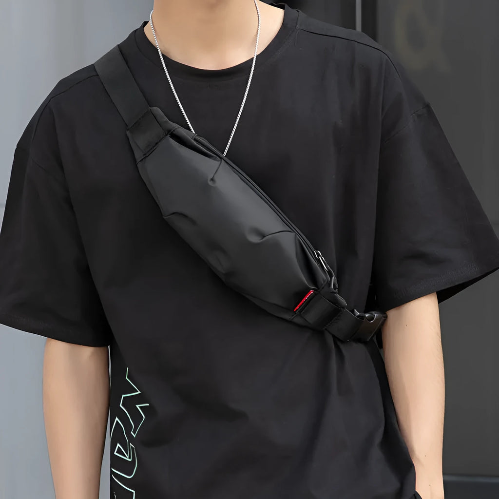Black Oxford cloth men's crossbody waist pack showing internal phone and ID pockets