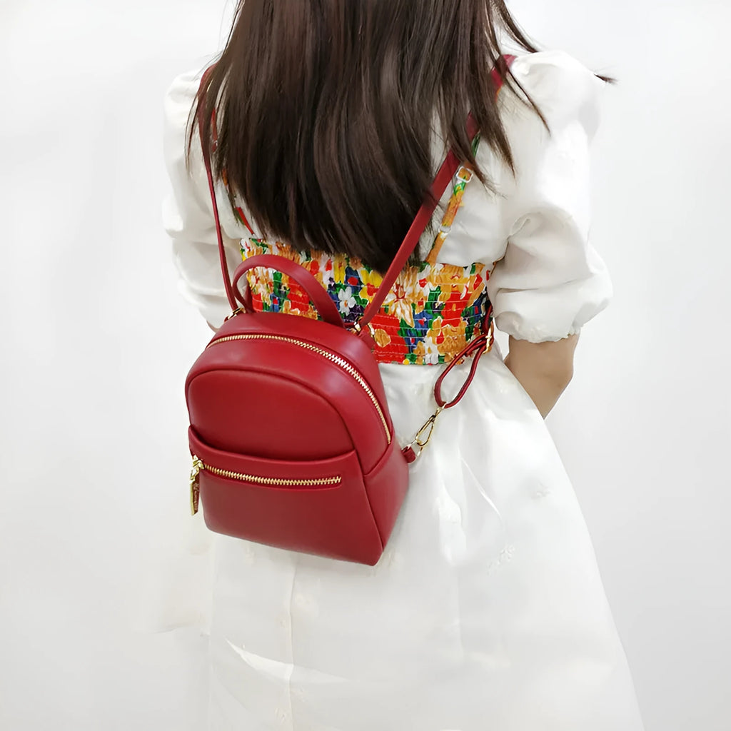 Soft PU mini backpack in street trend style with three-dimensional outer pocket, shown in one of six colour options.