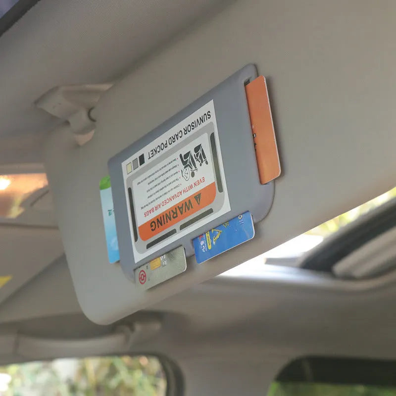 Black car sun visor card holder with four slots for driving licence and parking permits