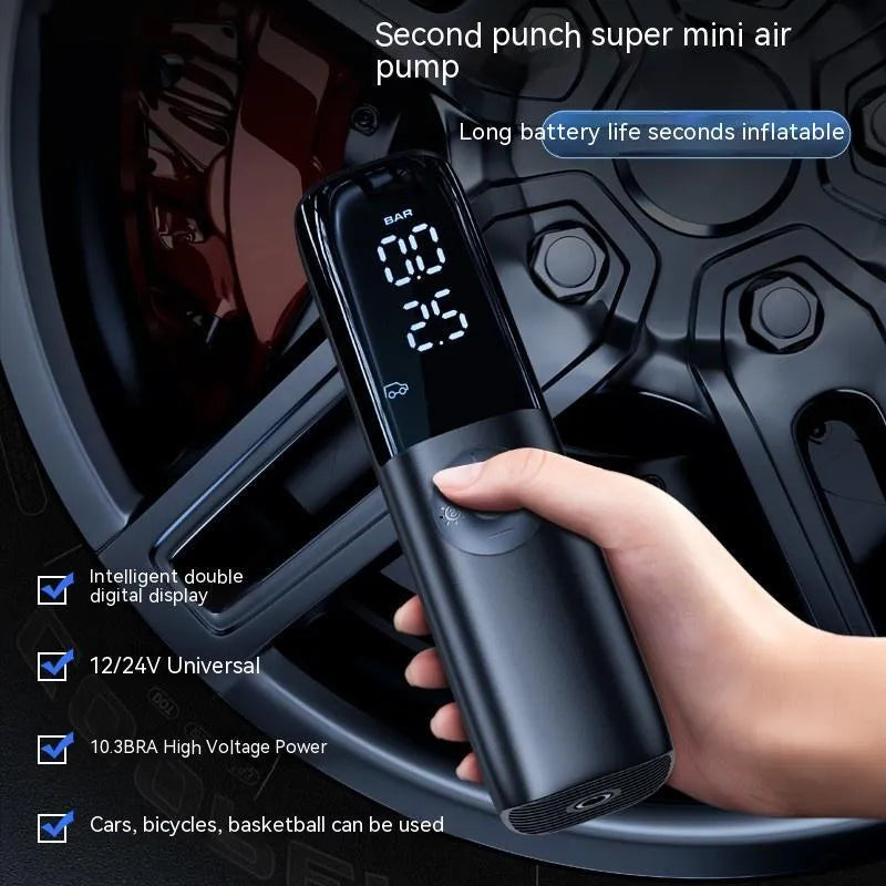 Black portable electric vehicle air pump with tyre pressure gauge and inflation tube