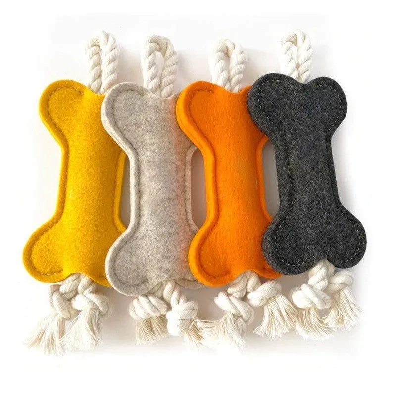 Bone-shaped dog chew toy with felt exterior showing rope knot texture inside, 16cm long in blue colour