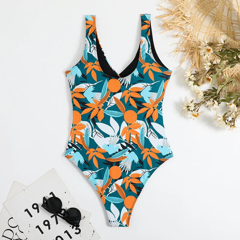Women's high-waist one-piece swimsuit with an all-over printed pattern in a conservative style.
