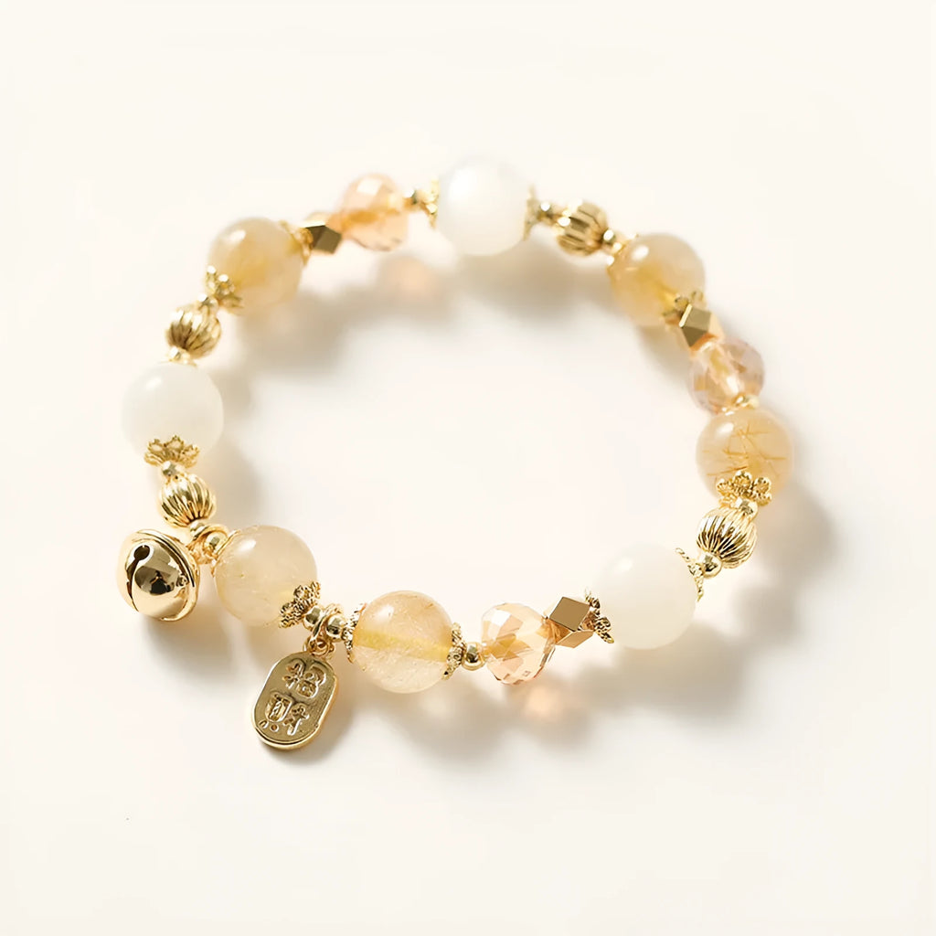 Gold tone rutilated quartz bracelet with electroplated finish and Korean style design