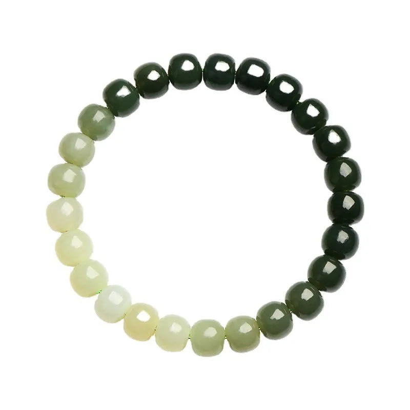 Hetian jade bracelet with clear water gradient beads on wrist.
