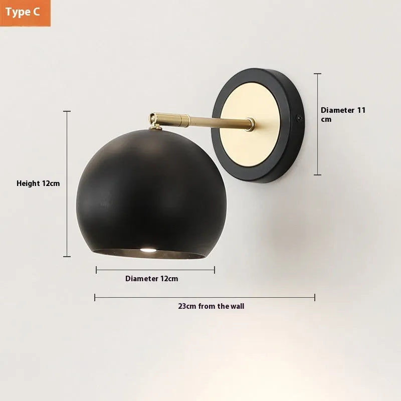 Nordic-style iron wall lamp mounted beside a bed with adjustable LED lighting