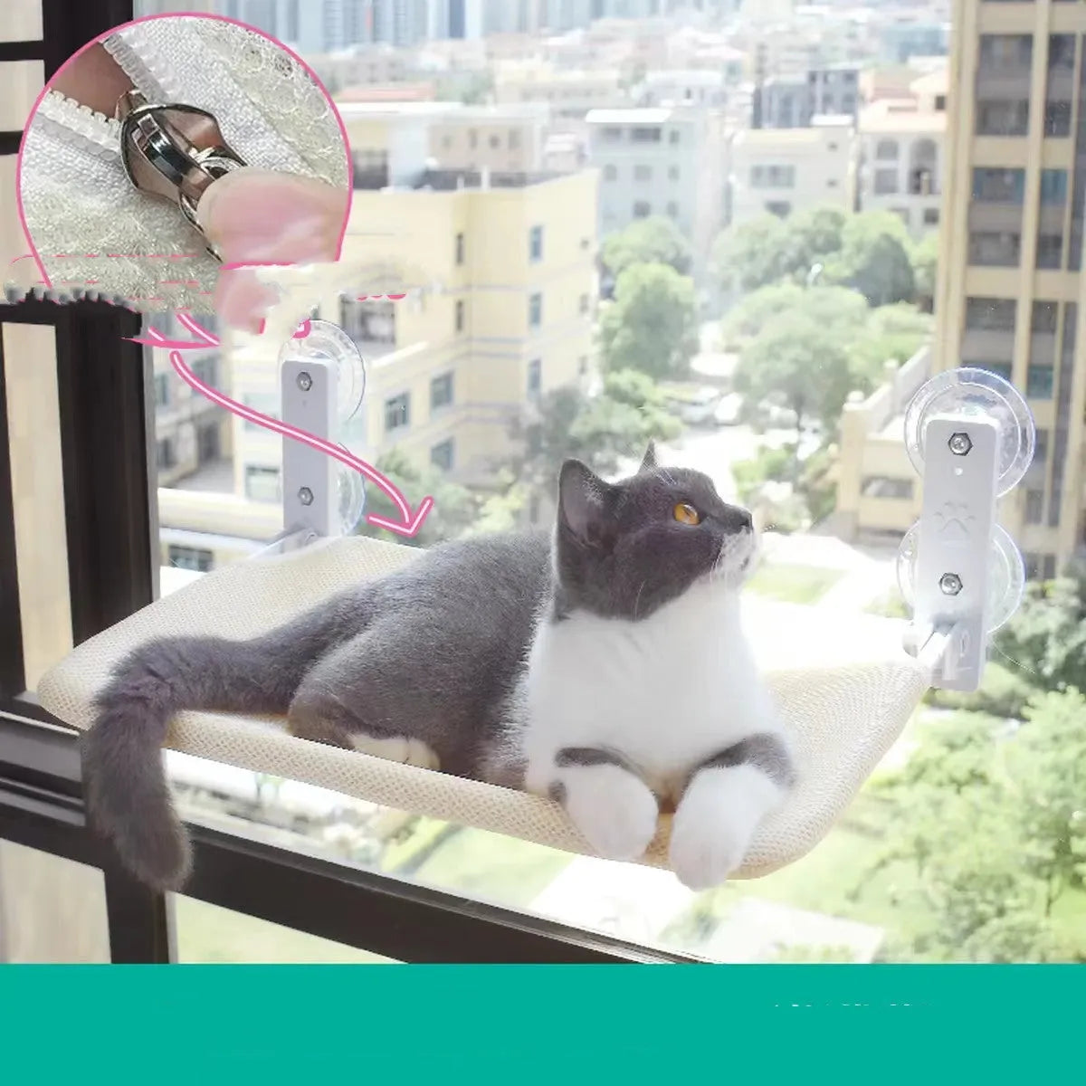 Cat resting on a suction cup window hammock made of plush fabric and steel in beige colour