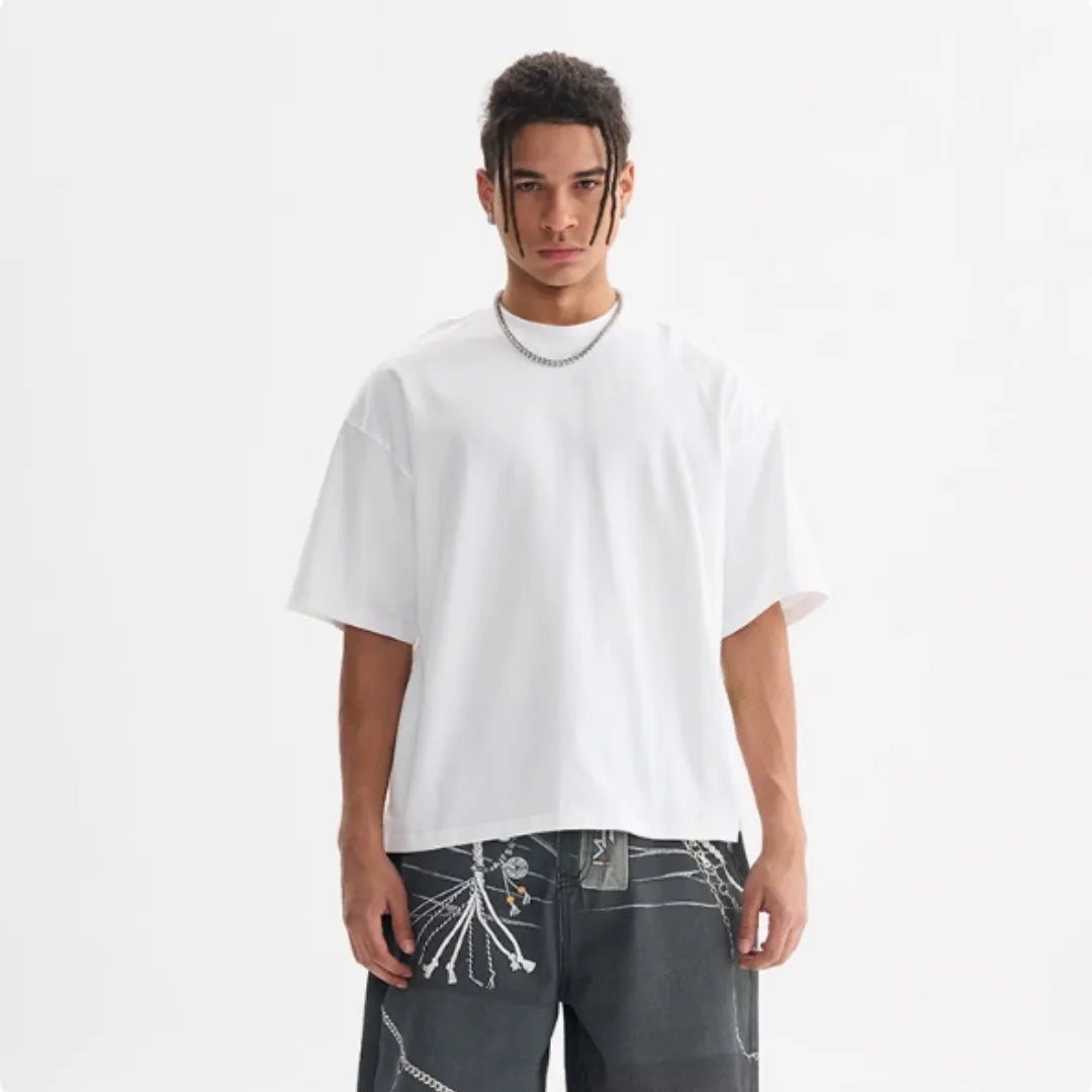 Pure cotton loose fit short sleeve t-shirt in apricot colour on a hanger.