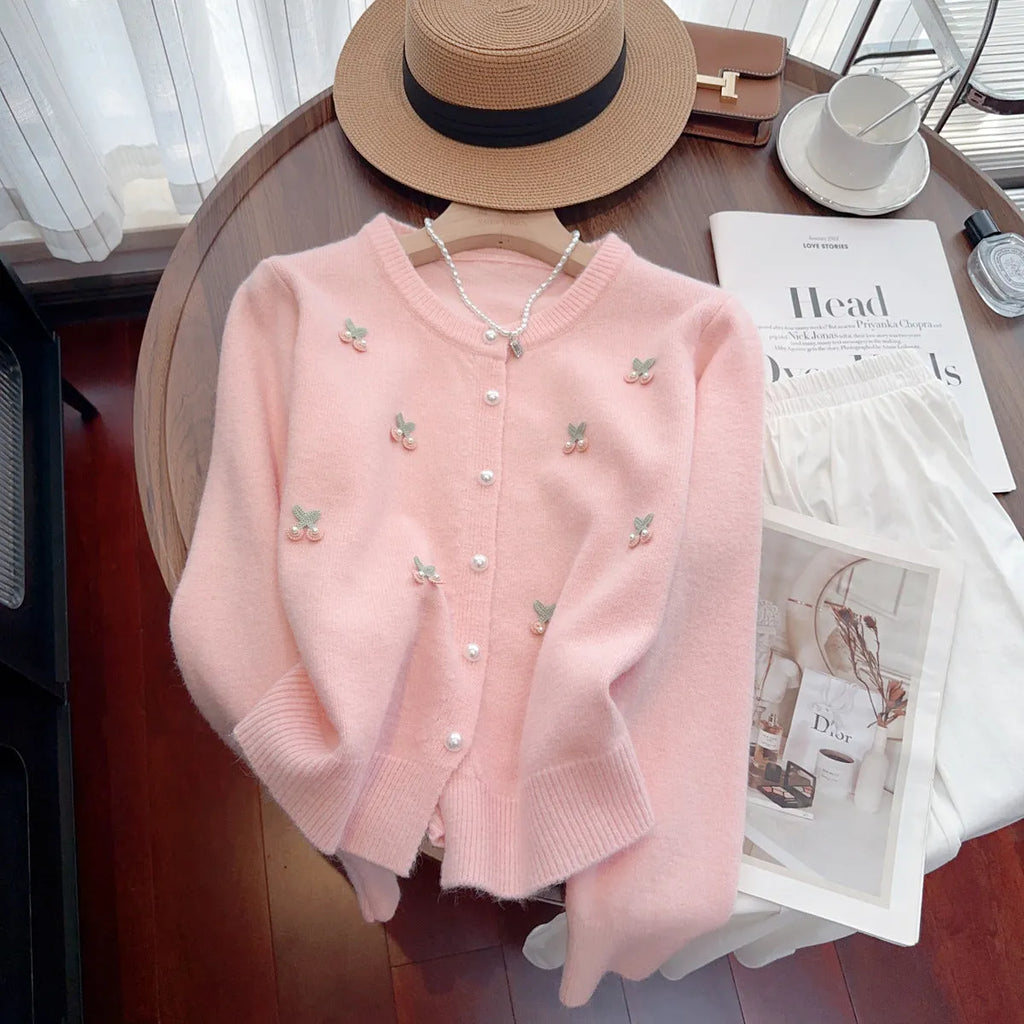 Women's cashmere cardigan with beaded detailing in pink colour showing round neck and slim fit
