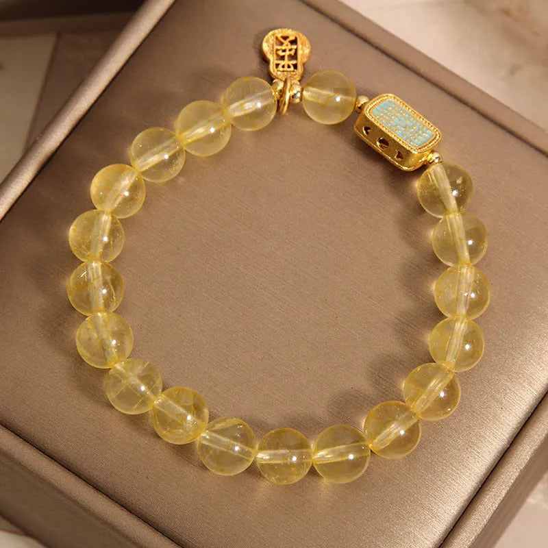 Women's natural yellow crystal bracelet with citrine colour tones and rhinestone decorative elements