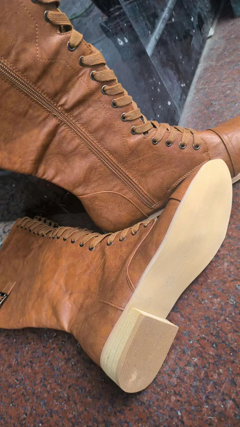 Women's black knight ankle boots with a cross-strap design, made from artificial PU leather.