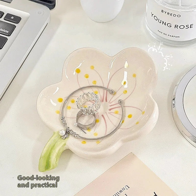 White porcelain decorative tray with optional small night light, shown in pink and yellow colour options.