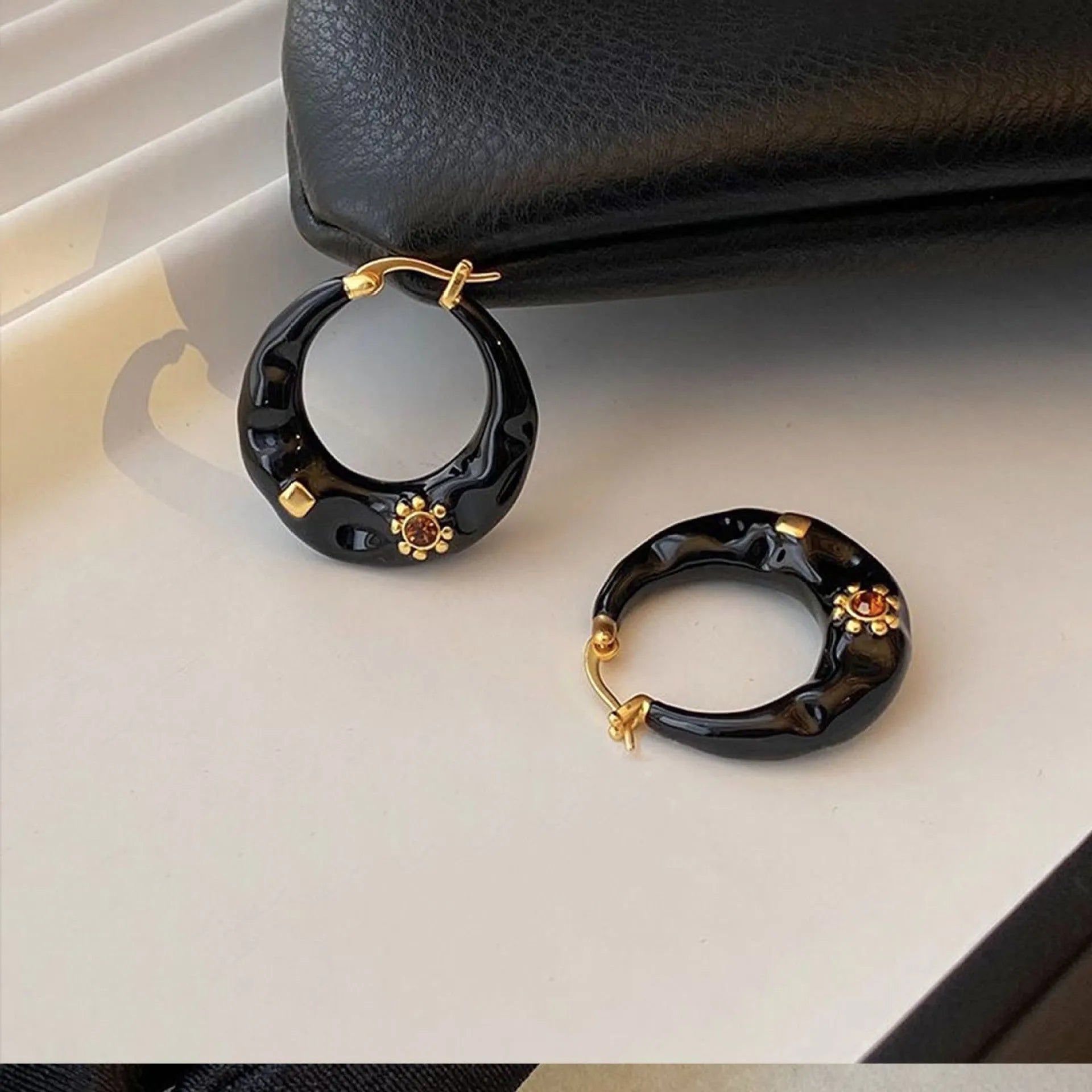 Hong Kong style retro ear studs with rhinestone decoration and dripping oil finish in black and red colour options