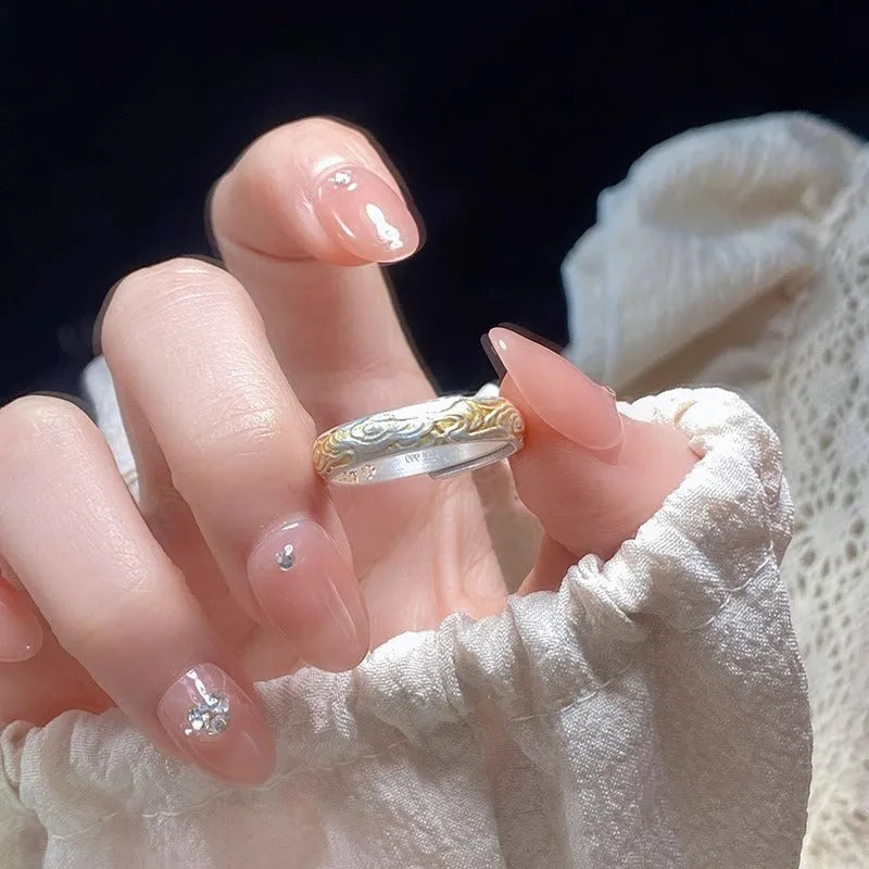 Geometric open mouth ring with Xiangyun pattern in electroplated silver and gold finish on white copper