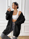 Women's loose fit acrylic cardigan with double pockets in dark green colour