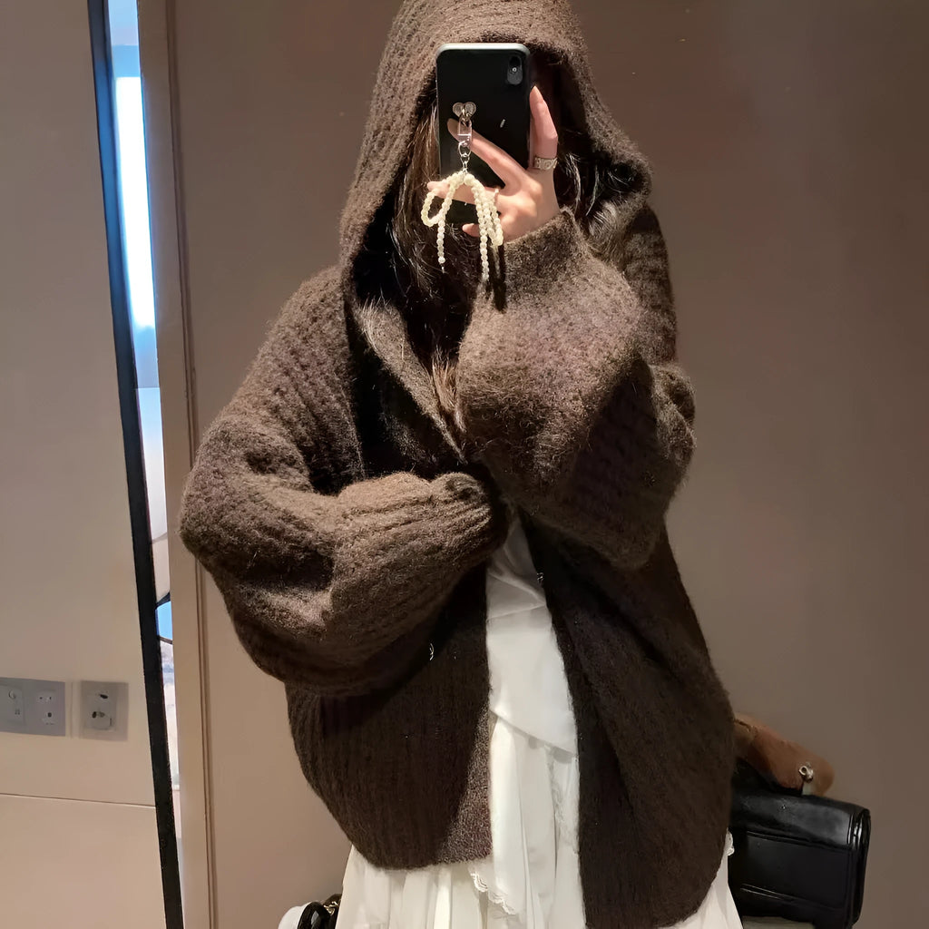 Women's dark grey loose-fit hooded cardigan sweater on a hanger