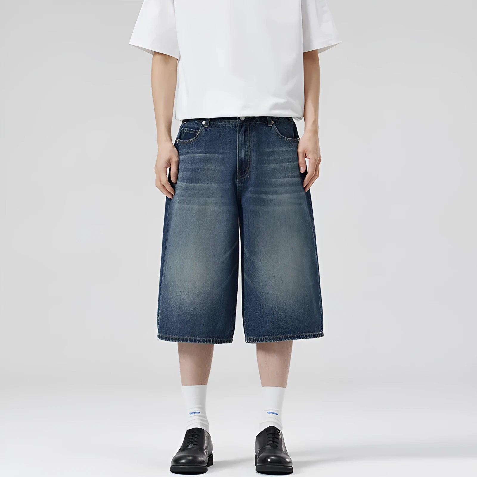 Men's loose straight-leg denim shorts in light blue colour showing cropped length and casual styling