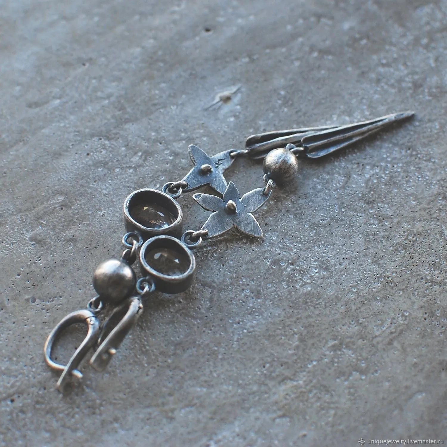 Geometric antique silver pendant earrings with XINGX design and rhinestone accents