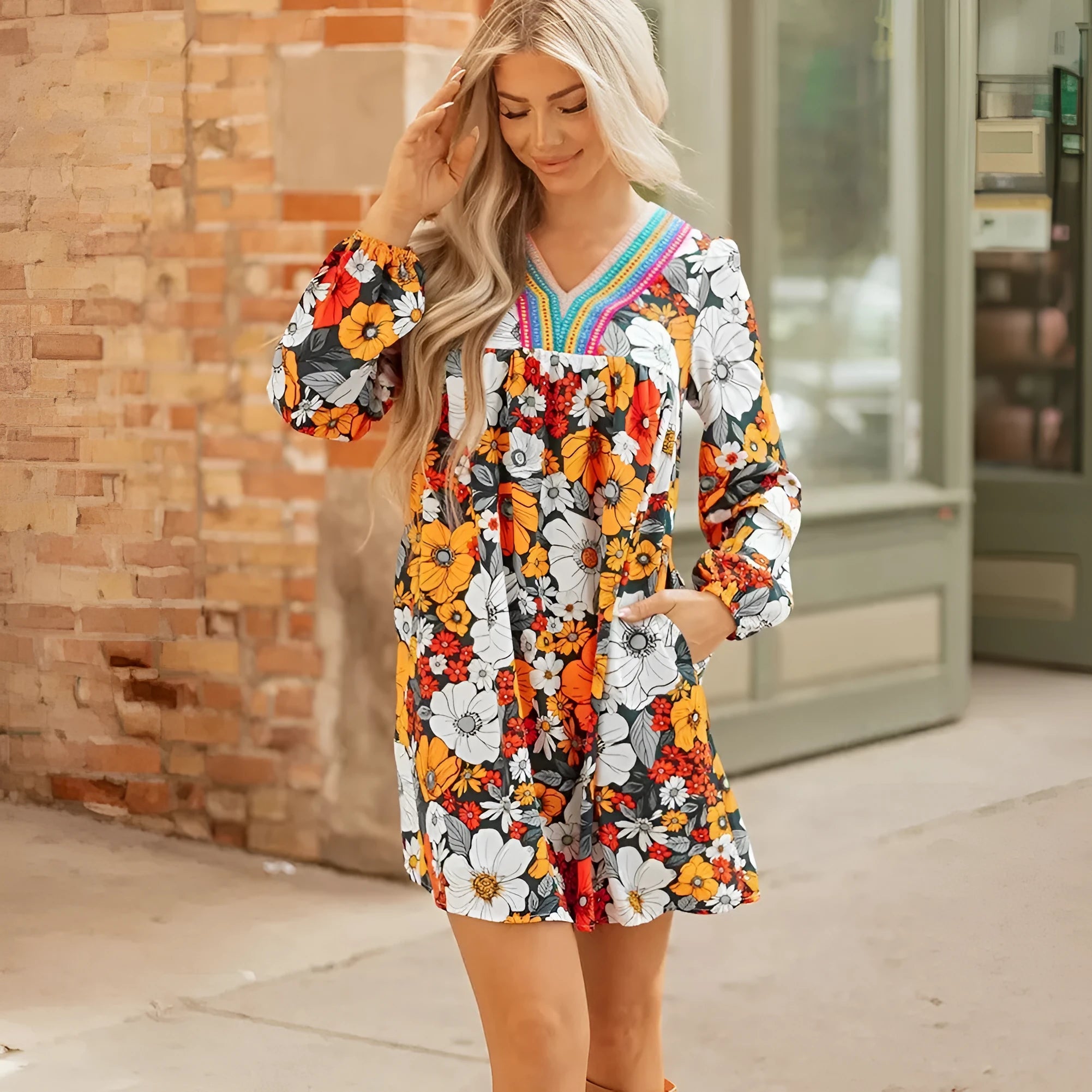 Orange floral print striped lace V-neck long sleeve mini dress on hanger
