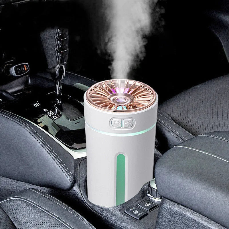 Black and white portable USB rechargeable humidifier with colourful lights for car and desktop use.