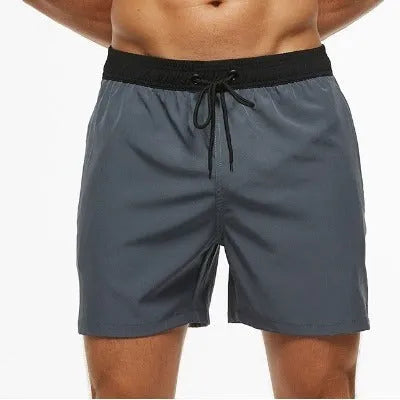 Men's blue running shorts with a stitching waistband, drawstring, and a side zippered pocket.