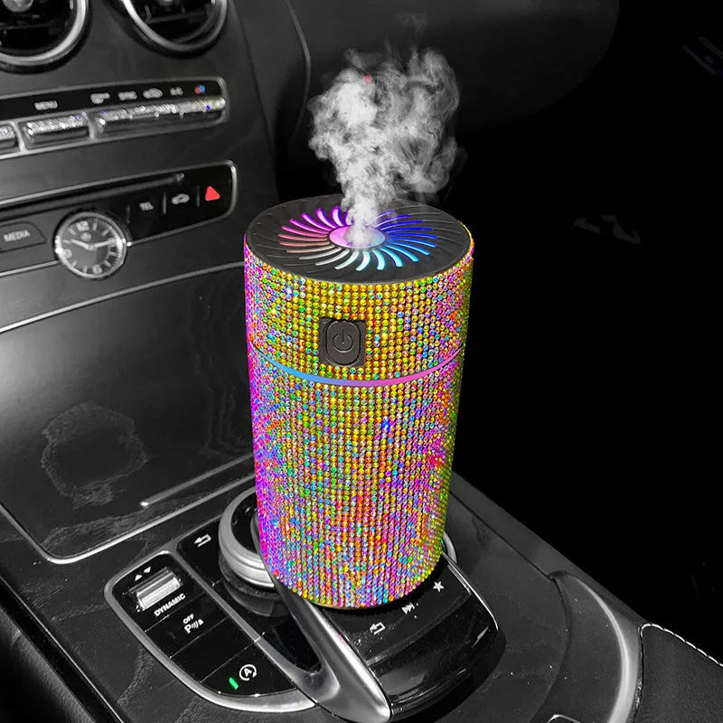 Compact white car air humidifier and purifier with USB cable on a car dashboard