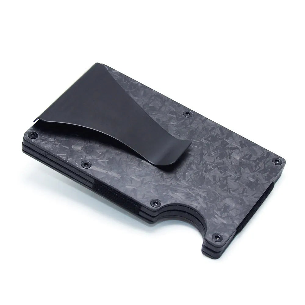Geometric carbon fibre and aluminium slim card holder wallet in multiple colour options on a table.