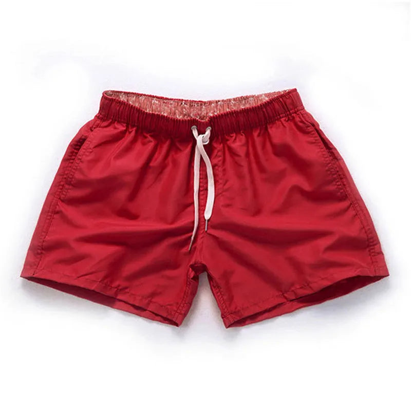 Men's straight leg polyester board shorts on a hanger, available in multiple colours and plus sizes.