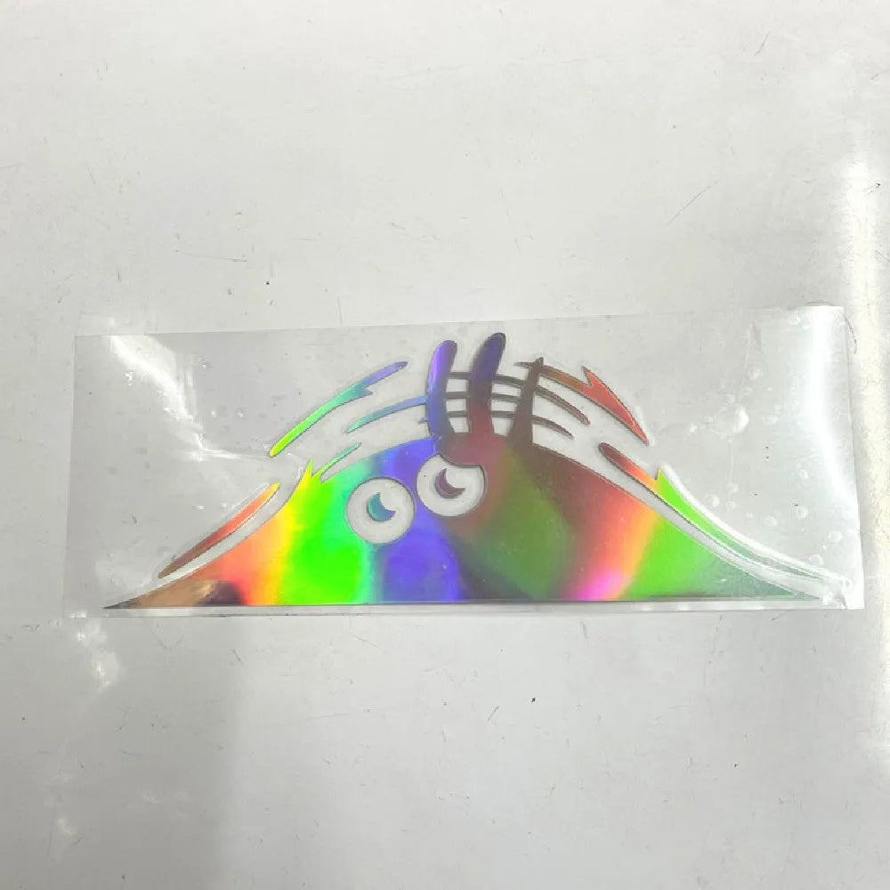 Self-adhesive body sticker measuring 19 cm by 7 cm showing smiley and angry face design options