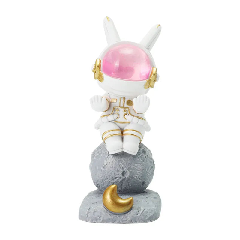 Space rabbit resin mobile phone stand in pink for desktop use