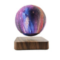 Square walnut magnetic levitation galaxy moon lamp floating above its circular base.