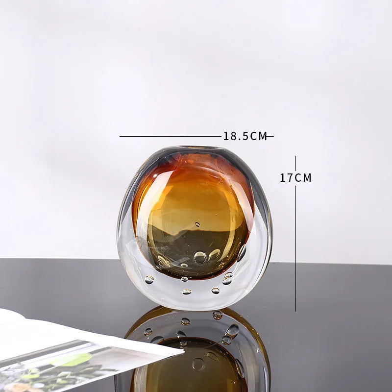 Small glass vase with amber coloured glaze, abstract modern shape, 13.5x25cm size on table