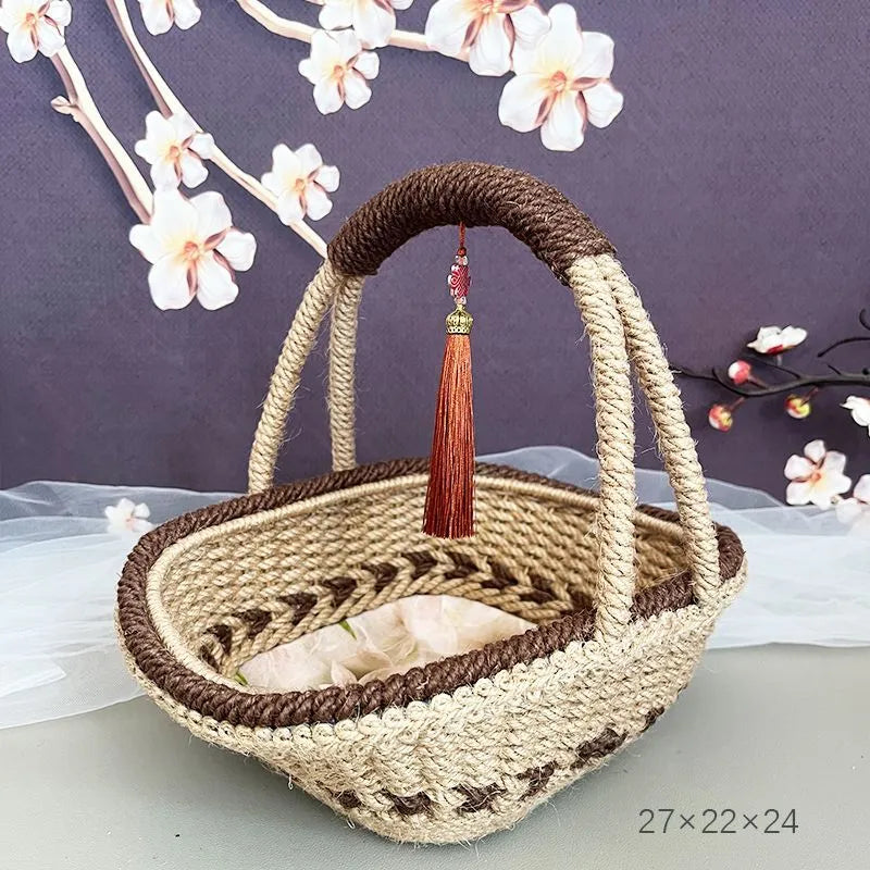Coffee brown hand-woven hemp rope basket with straw trim, shown from the side.