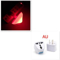 Mushroom-shaped LED night light with light sensor, warm yellow glow, plugging into a wall socket